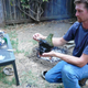 Study co-author Kevin Smith applying the melted bitumen to the bottle, with the air testing equipment next to him. (Image: Nicholas Radtkey)